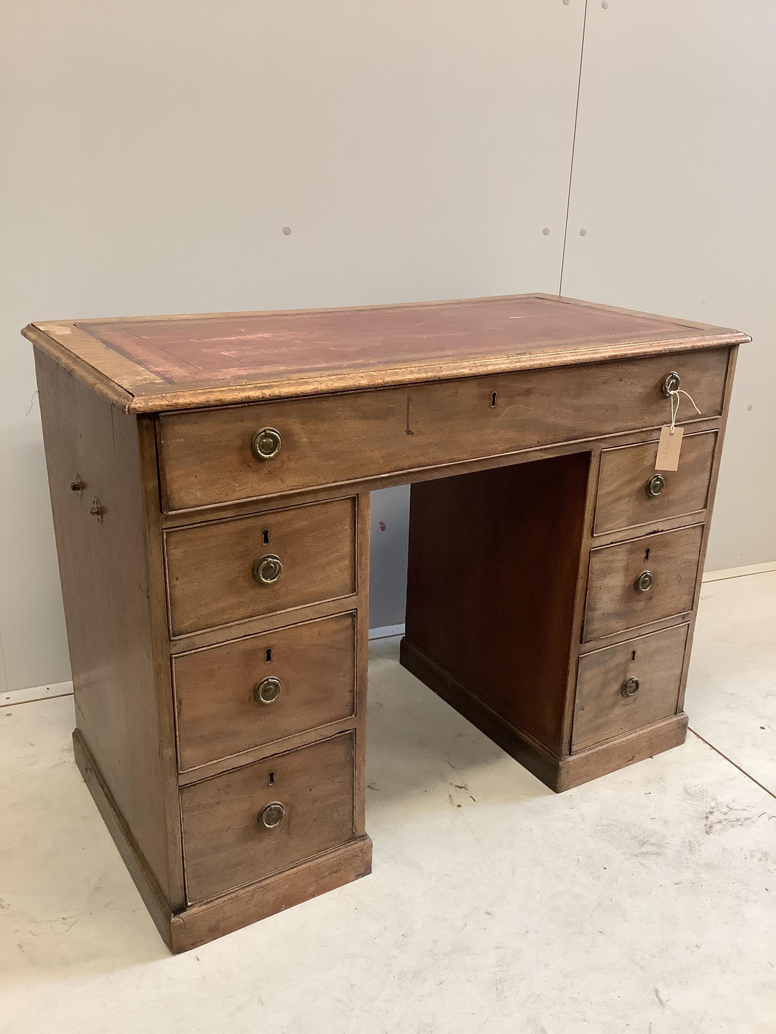A mahogany seven drawer desk, width 102cm, depth 52cm, height 78cm